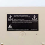 Acorn Archimedes A3010 "hazardous voltages" warning label